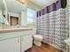Clean bathroom with shower/tub combo and patterned shower curtain at 3610 Rollingbrook St, Clermont, FL 34711
