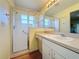Bathroom featuring a shower, vanity with under-sink storage and toilet at 3610 Rollingbrook St, Clermont, FL 34711