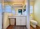 Clean bathroom with shower, toilet, vanity, and linen closet at 3610 Rollingbrook St, Clermont, FL 34711
