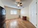 Bright bedroom with wood-look floors and ceiling fan at 3610 Rollingbrook St, Clermont, FL 34711
