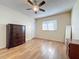 Well-lit bedroom with wood-look floors and ceiling fan at 3610 Rollingbrook St, Clermont, FL 34711