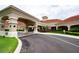 Community center entrance with covered walkway and landscaping at 3610 Rollingbrook St, Clermont, FL 34711