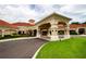Community center entrance with covered walkway and landscaping at 3610 Rollingbrook St, Clermont, FL 34711
