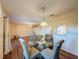 Dining area with round glass table and four chairs at 3610 Rollingbrook St, Clermont, FL 34711