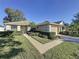 House exterior with well-maintained landscaping at 3610 Rollingbrook St, Clermont, FL 34711