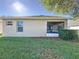 House exterior showcasing a screened porch and yard at 3610 Rollingbrook St, Clermont, FL 34711