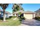 Cute one-story house with a two-car garage and well-manicured lawn at 3610 Rollingbrook St, Clermont, FL 34711
