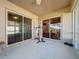 Screened porch with tile flooring and exercise equipment at 3610 Rollingbrook St, Clermont, FL 34711