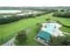 Community pool and surrounding green space, from above at 3817 Doune Way, Clermont, FL 34711