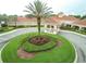 Aerial view showing community clubhouse and lush landscaping at 3817 Doune Way, Clermont, FL 34711