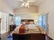 Bright bedroom with a king-size bed and sliding glass doors at 3817 Doune Way, Clermont, FL 34711