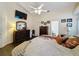 Main bedroom with a king bed, dresser, and access to a bathroom at 3817 Doune Way, Clermont, FL 34711
