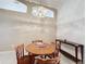 Dining room features a round table with four chairs and a wooden console table at 3817 Doune Way, Clermont, FL 34711