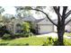 House exterior showcasing a well-maintained lawn and attractive curb appeal at 3817 Doune Way, Clermont, FL 34711