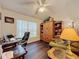 Home office features built-in shelving and a comfortable armchair at 3817 Doune Way, Clermont, FL 34711