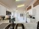 Bright kitchen with white cabinets and a double sink at 3817 Doune Way, Clermont, FL 34711