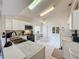 Kitchen features white cabinets, stainless steel appliances, and a breakfast nook at 3817 Doune Way, Clermont, FL 34711