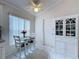 Bright kitchen features white cabinets, stainless steel appliances, and a breakfast nook at 3817 Doune Way, Clermont, FL 34711