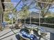 Relaxing screened patio with tiled table and benches, perfect for outdoor dining at 3817 Doune Way, Clermont, FL 34711