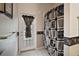 Bathroom with exterior access and patterned shower curtain at 3839 Manor Oaks Ct, Leesburg, FL 34748