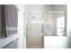 Bathroom with a large walk-in shower and built-in shelving at 3839 Manor Oaks Ct, Leesburg, FL 34748