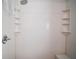 Clean shower with built-in shelves and seating at 3839 Manor Oaks Ct, Leesburg, FL 34748