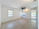 Bedroom with ceiling fan and multiple windows at 407 Park Ln, Eustis, FL 32726