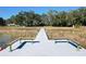 Long dock with benches overlooking the lake at 407 Park Ln, Eustis, FL 32726