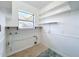 Laundry room with shelving and linoleum floor at 407 Park Ln, Eustis, FL 32726