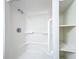 Shower with grab bars and built-in shelving at 407 Park Ln, Eustis, FL 32726