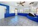 Sunroom with tiled floor and a fireplace at 407 Park Ln, Eustis, FL 32726