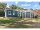 House exterior with a pergola and large backyard at 43140 Hossin Around Ln, Altoona, FL 32702