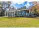 Exterior view shows a teal home with a pergola at 43140 Hossin Around Ln, Altoona, FL 32702