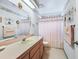 Pink bathroom with shower/tub combo and updated vanity at 510 Galloway Ct, Leesburg, FL 34788