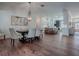 Elegant dining room with a large chandelier and seating for six at 640 Ternberry Forest Dr, The Villages, FL 32162