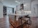 Kitchen island with white countertop, wooden base, and two bar stools at 640 Ternberry Forest Dr, The Villages, FL 32162