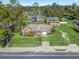Aerial view of a single-Gathering home with a large yard and a second building on the property at 703 & 705 Cleveland Ave, Wildwood, FL 34785