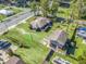 Aerial view showing a house and separate building with a large yard at 703 & 705 Cleveland Ave, Wildwood, FL 34785