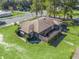 Single story home with spacious backyard and surrounding trees at 703 & 705 Cleveland Ave, Wildwood, FL 34785