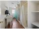 Clean public restroom with multiple shower stalls and sinks at 703 & 705 Cleveland Ave, Wildwood, FL 34785