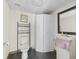 Simple bathroom with toilet, sink, and folding doors at 703 & 705 Cleveland Ave, Wildwood, FL 34785