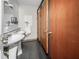 Restroom with urinal, sinks, and individual stalls at 703 & 705 Cleveland Ave, Wildwood, FL 34785
