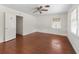 Bright bedroom with hardwood floors and window at 703 & 705 Cleveland Ave, Wildwood, FL 34785