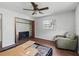 Bedroom with wood flooring, ceiling fan, and closet at 703 & 705 Cleveland Ave, Wildwood, FL 34785