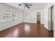 Bedroom with hardwood floors and a closet at 703 & 705 Cleveland Ave, Wildwood, FL 34785