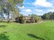 House exterior with lush green lawn at 703 & 705 Cleveland Ave, Wildwood, FL 34785
