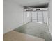 Empty garage with overhead door and concrete floor at 703 & 705 Cleveland Ave, Wildwood, FL 34785