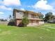 Two-story house with brick and siding exterior at 703 & 705 Cleveland Ave, Wildwood, FL 34785