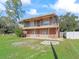 Two-story house with brick and siding exterior at 703 & 705 Cleveland Ave, Wildwood, FL 34785