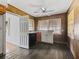 Kitchen with wood cabinets and vinyl flooring at 703 & 705 Cleveland Ave, Wildwood, FL 34785